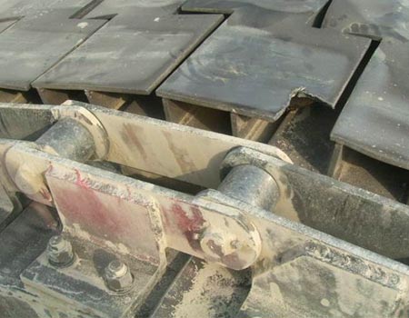 Cadena alimentadora de delantal